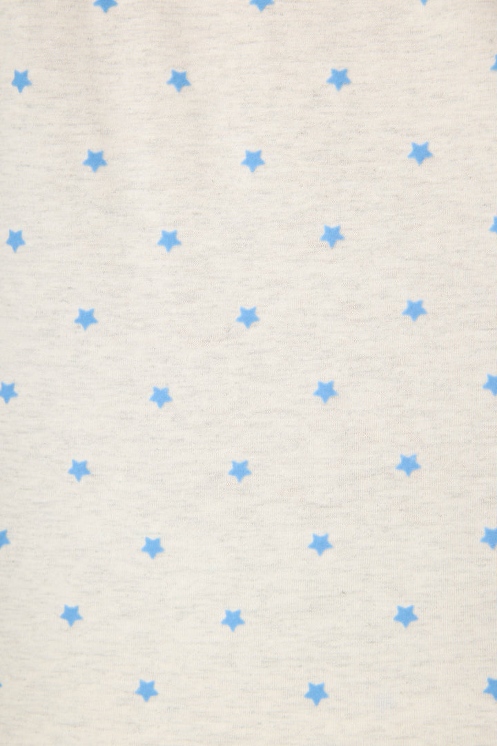 The P.J. Salvage Pant Set FLOCKING NOTCH COLLAR PJ SET LADY LUCK features white fabric adorned with a repeating pattern of small, evenly spaced blue stars.