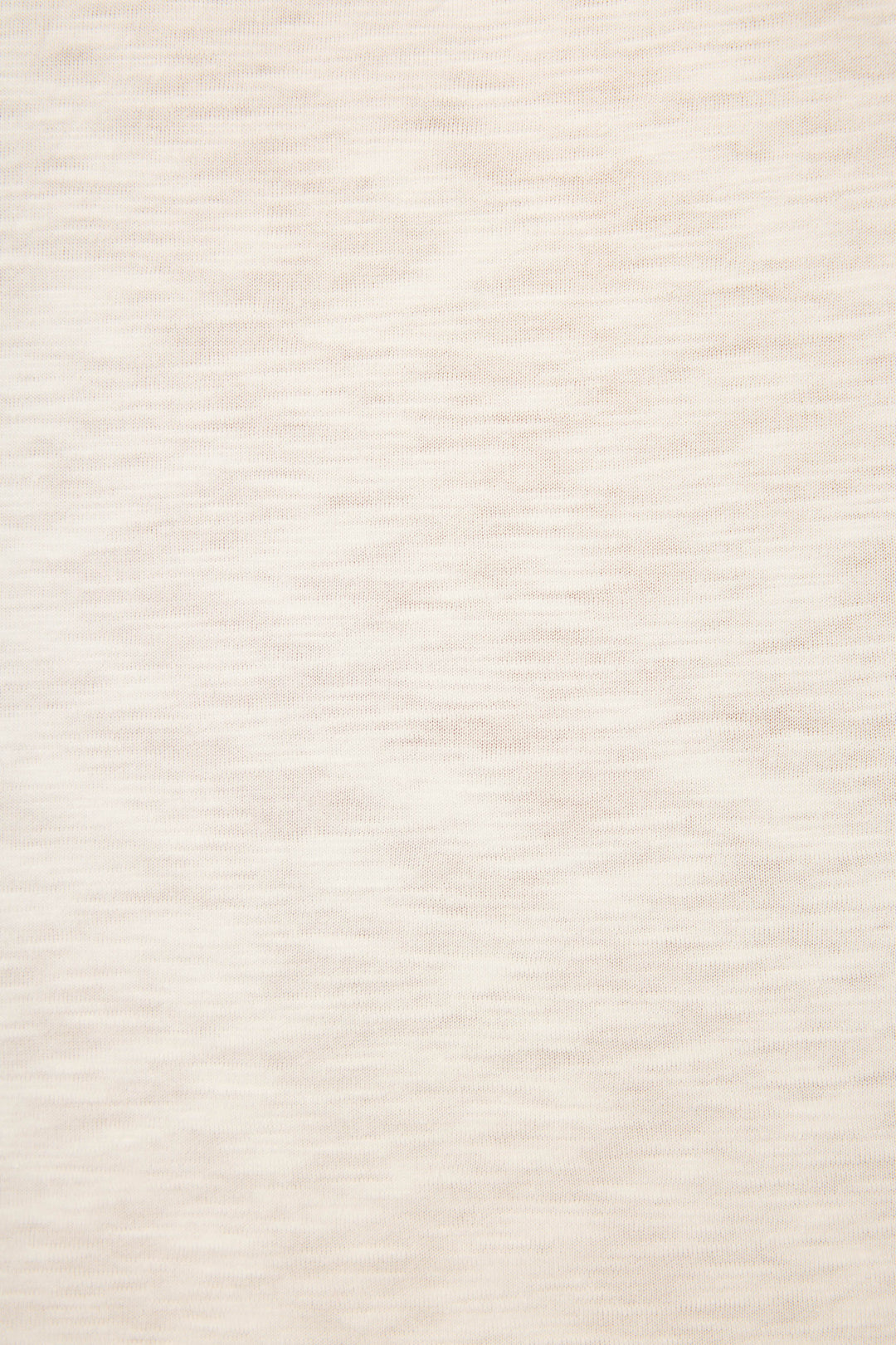 A close-up of the P.J. Salvage Love You A Latte Coffee Print Long Sleeve Top shows its light beige, heathered fabric with subtle horizontal streaks and a soft, slightly textured surface.