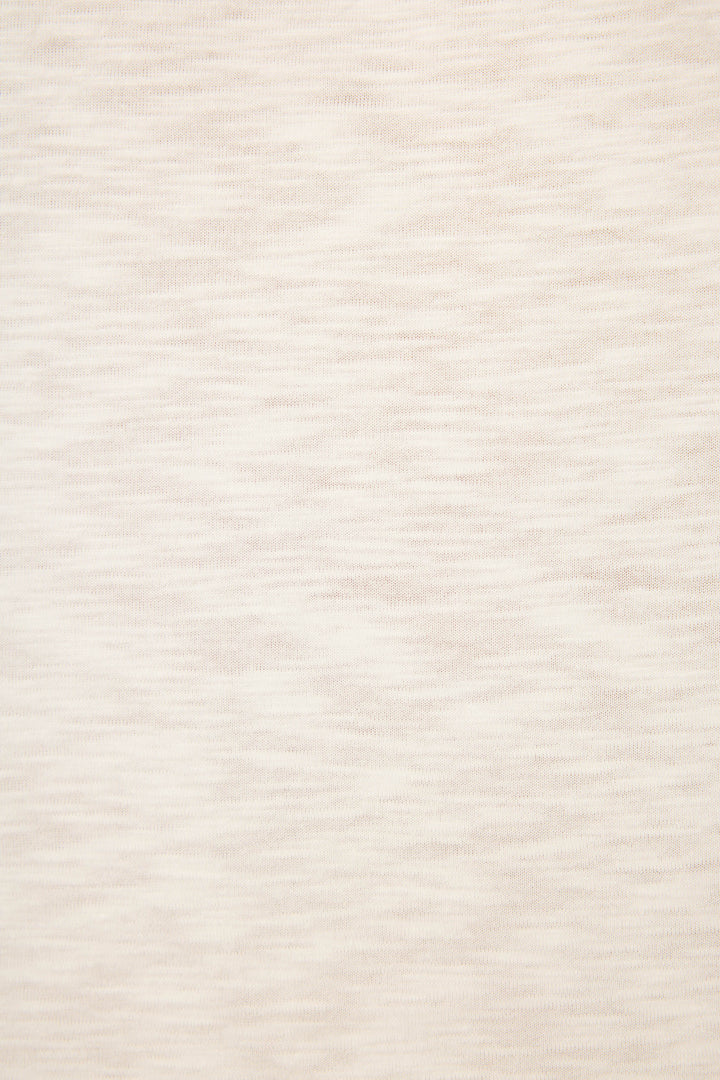 A close-up of the P.J. Salvage Love You A Latte Coffee Print Long Sleeve Top shows its light beige, heathered fabric with subtle horizontal streaks and a soft, slightly textured surface.