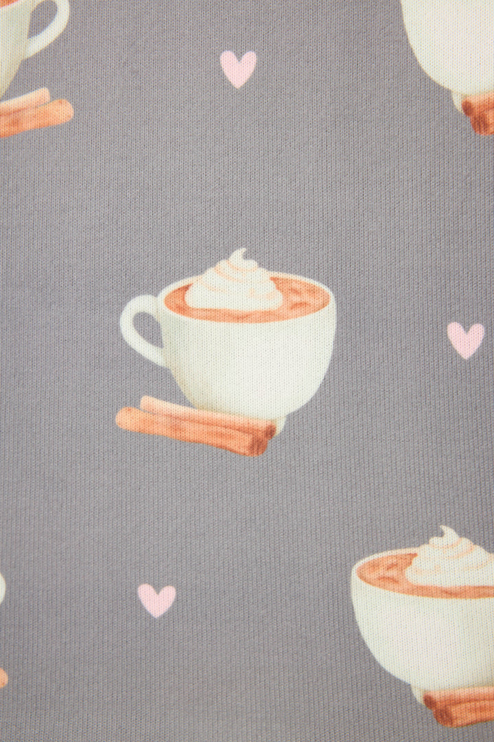 The P.J. Salvage Love You A Latte Coffee Print Banded Pant features a gray fabric with white cups of whipped cream-topped hot chocolate, cinnamon sticks, and small pink hearts.