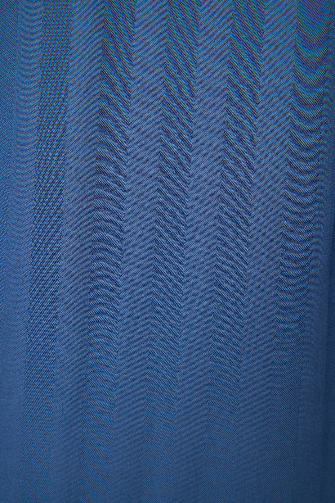 A close-up of the STRIPES PJ SET LA ROSE by P.J. Salvage shows blue fabric with subtle vertical stripes and a fine woven texture, featuring an evenly repeating pattern.