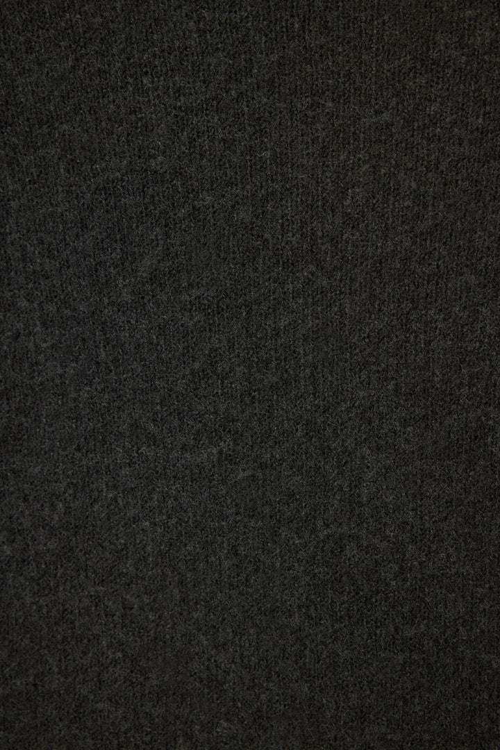 Close-up of the Merrier With A Martini Snuggle Sweater by P.J. Salvage, featuring dark gray, soft textured fabric with a subtle knit pattern. The surface appears slightly fuzzy and uniform with no visible seams.
