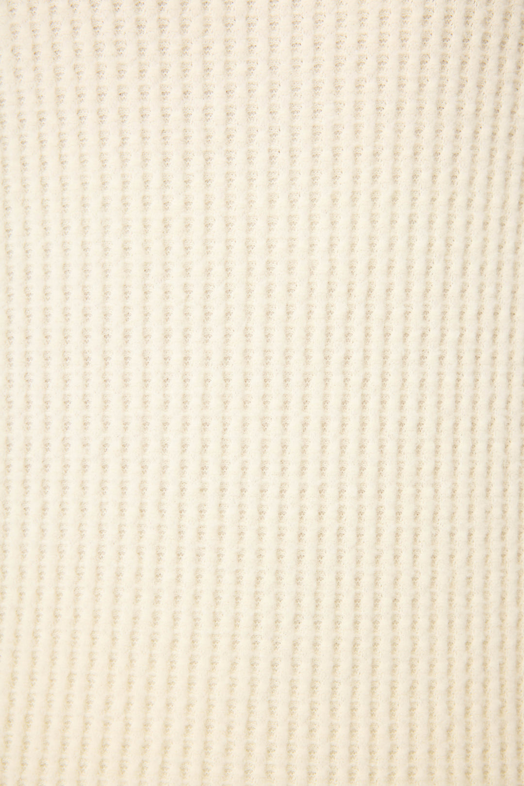 Close-up of the Morning Waffles Solid Ivory Long Sleeve Top by P.J. Salvage, featuring a cream-colored, ribbed textured fabric with a soft, evenly woven finish.