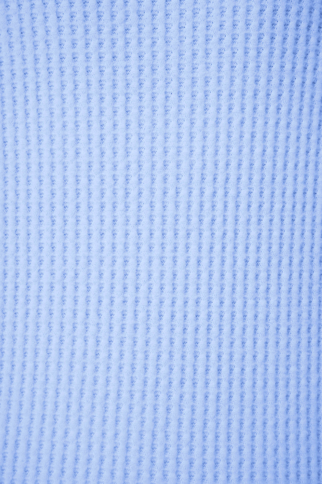 Close-up of the Morning Waffles Solid Peri Long Sleeve Top by P.J. Salvage, showing its textured blue fabric and repeating vertical ribbed pattern that highlights the soft material and detailed weave.