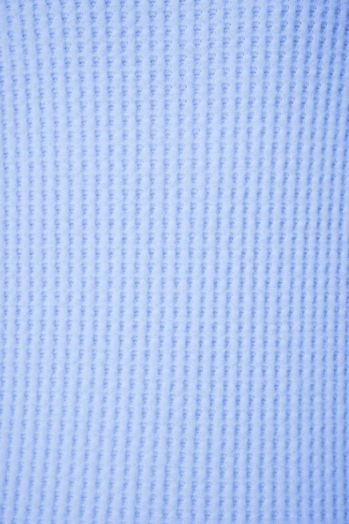 Close-up of the Morning Waffles Solid Peri Long Sleeve Top by P.J. Salvage, showing its textured blue fabric and repeating vertical ribbed pattern that highlights the soft material and detailed weave.