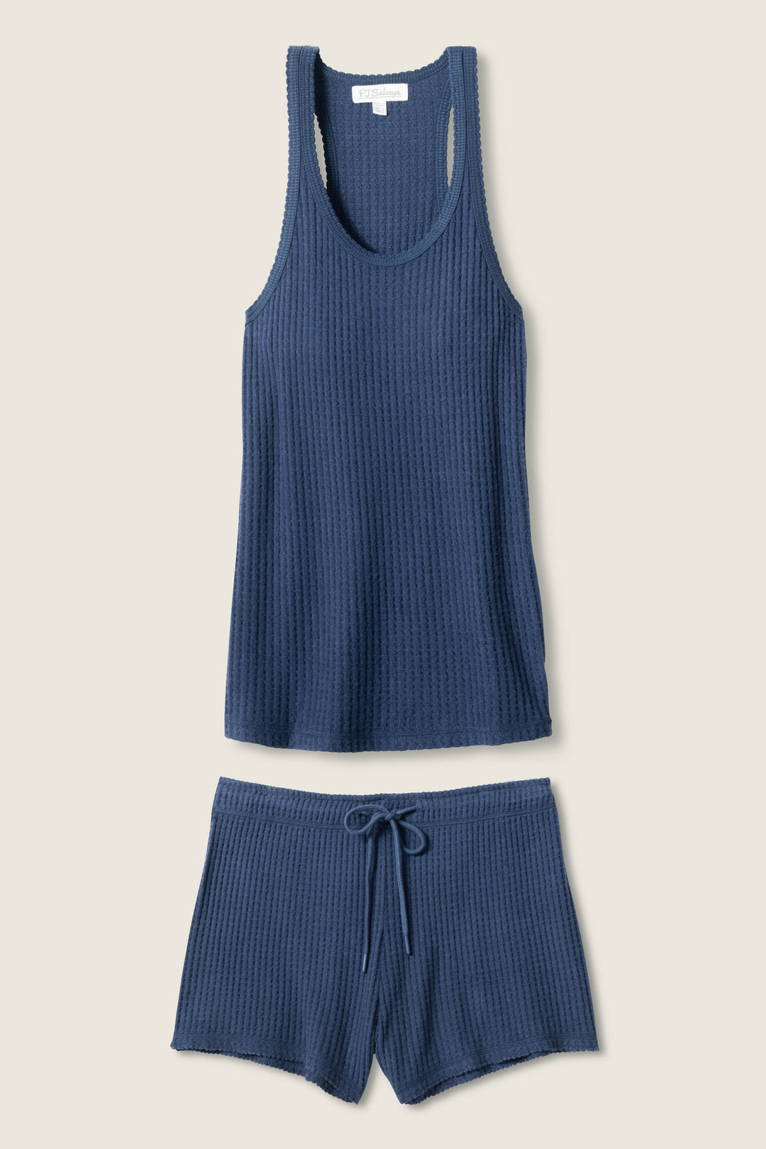The P.J. Salvage Morning Waffles Harbor Loungewear Set—a blue waffle knit racerback tank and drawstring shorts—is displayed flat on a neutral background.