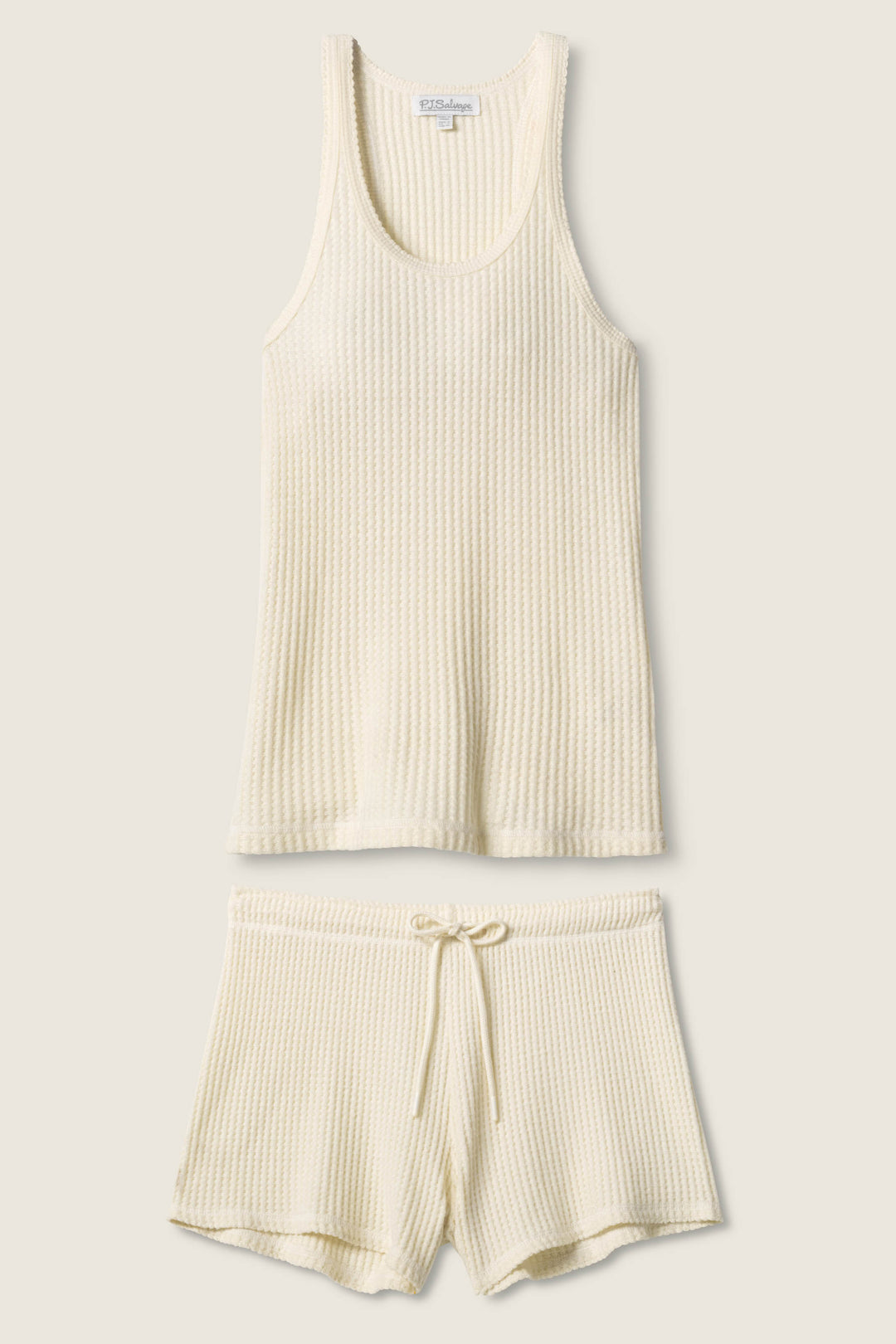 The P.J. Salvage Morning Waffles Solid Ivory Loungewear Set, featuring a sleeveless ribbed knit tank top and drawstring shorts, is displayed laid flat on a neutral background.