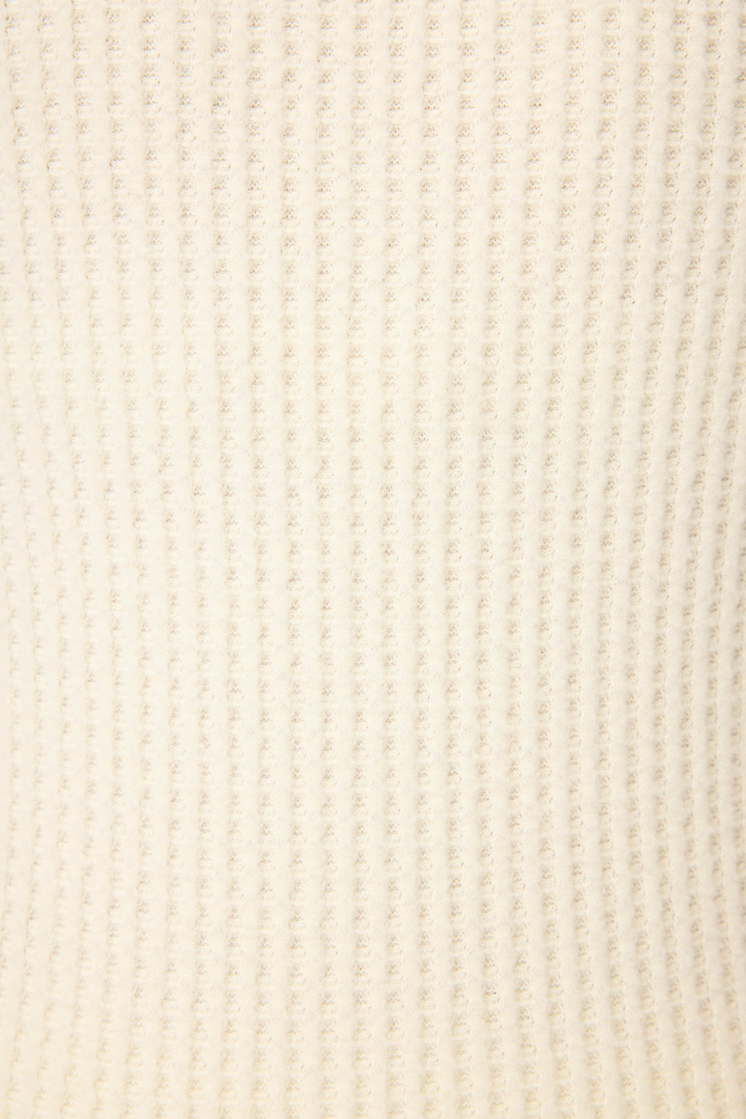 Close-up of the P.J. Salvage Morning Waffles Solid Ivory Loungewear Set, featuring a soft, cream-colored ribbed knit fabric with vertical ridges creating a cozy, repeating textured pattern.