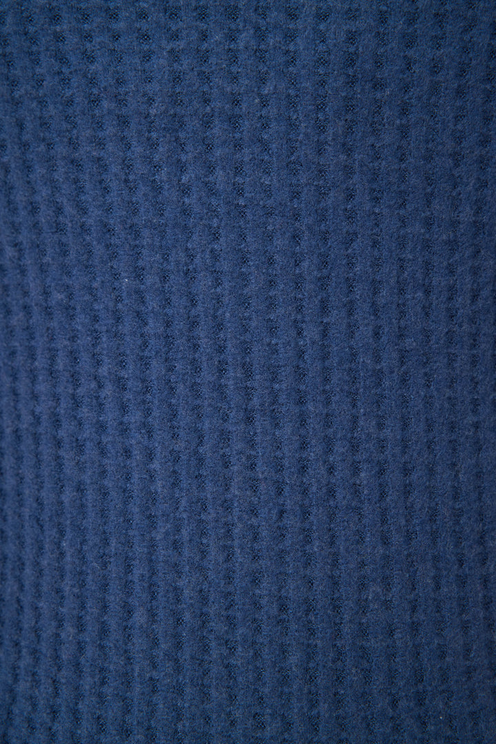Close-up of P.J. Salvage Morning Waffles Solid Navy Shorts, showing a blue, textured fabric with vertical ribbing. The material looks soft and cozy, with no visible seams or extra details.