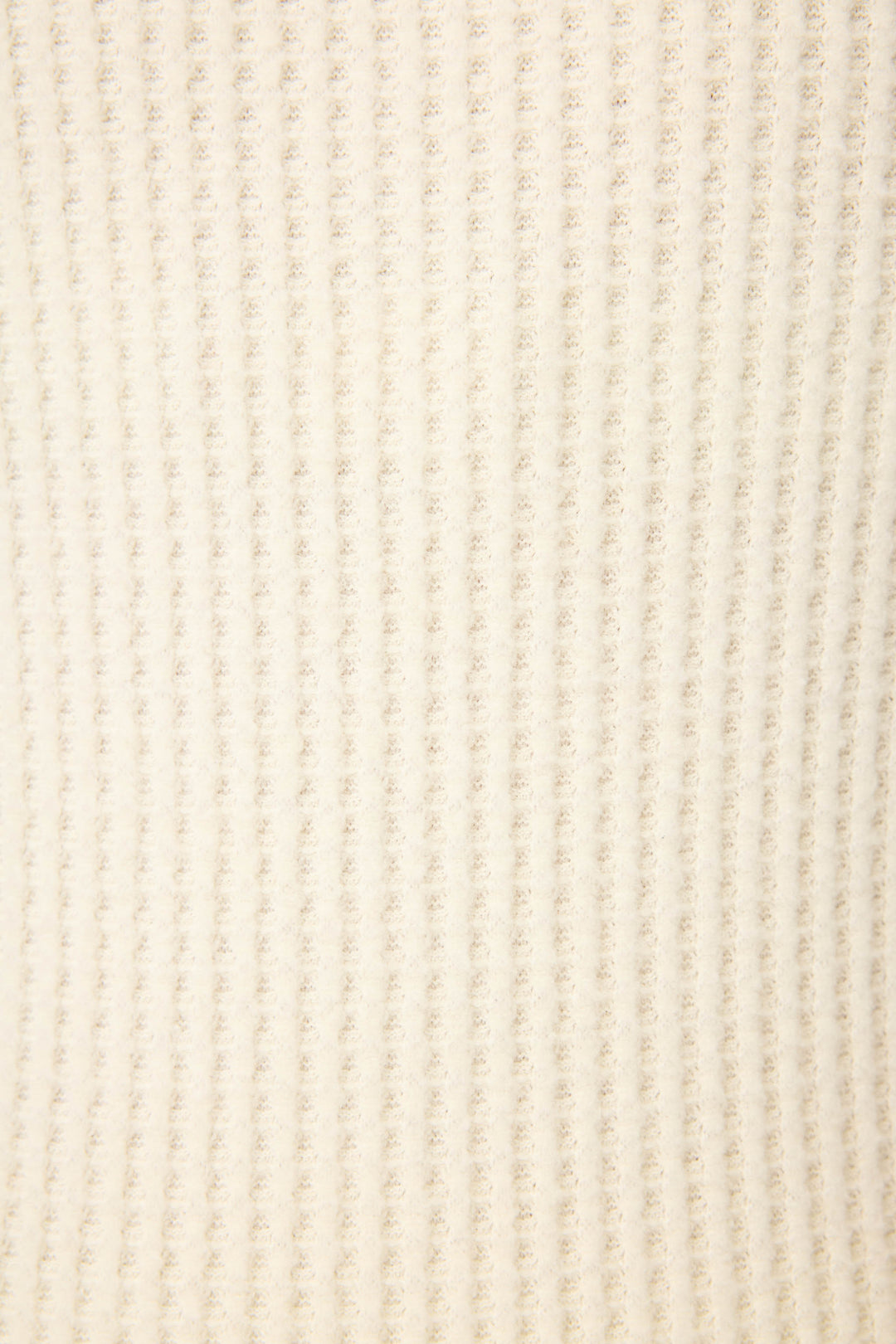 Close-up of a soft, cream-colored ribbed fabric with vertical lines, featured in P.J. Salvage’s Morning Waffles Natural Shorts—perfect for cozy loungewear.