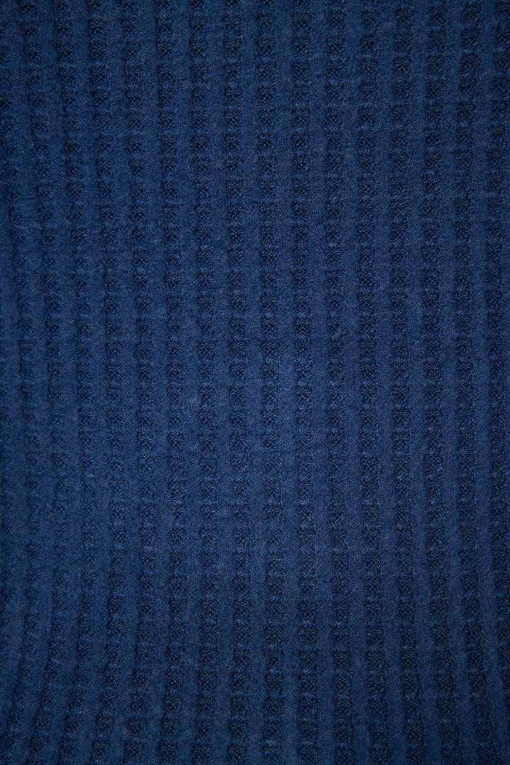 Close-up of the Morning Waffles Solid Navy Tank Top by P.J. Salvage, showing its soft, textured dark blue fabric with a vertical ribbed pattern that looks both cozy and stylish.