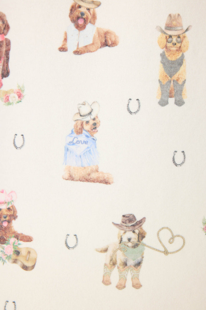 The P.J. Salvage DOGS V-NECK TANK RUFF ON THE RANGE features illustrated dogs in cowboy hats and western outfits, with small horseshoe icons, set against a light background.