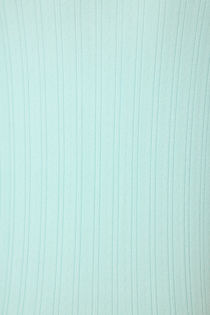 The P.J. Salvage Pointelle Essentials Solid Mint Night Shirt features a light blue textured surface with evenly spaced vertical lines and subtle wavy patterns from top to bottom.