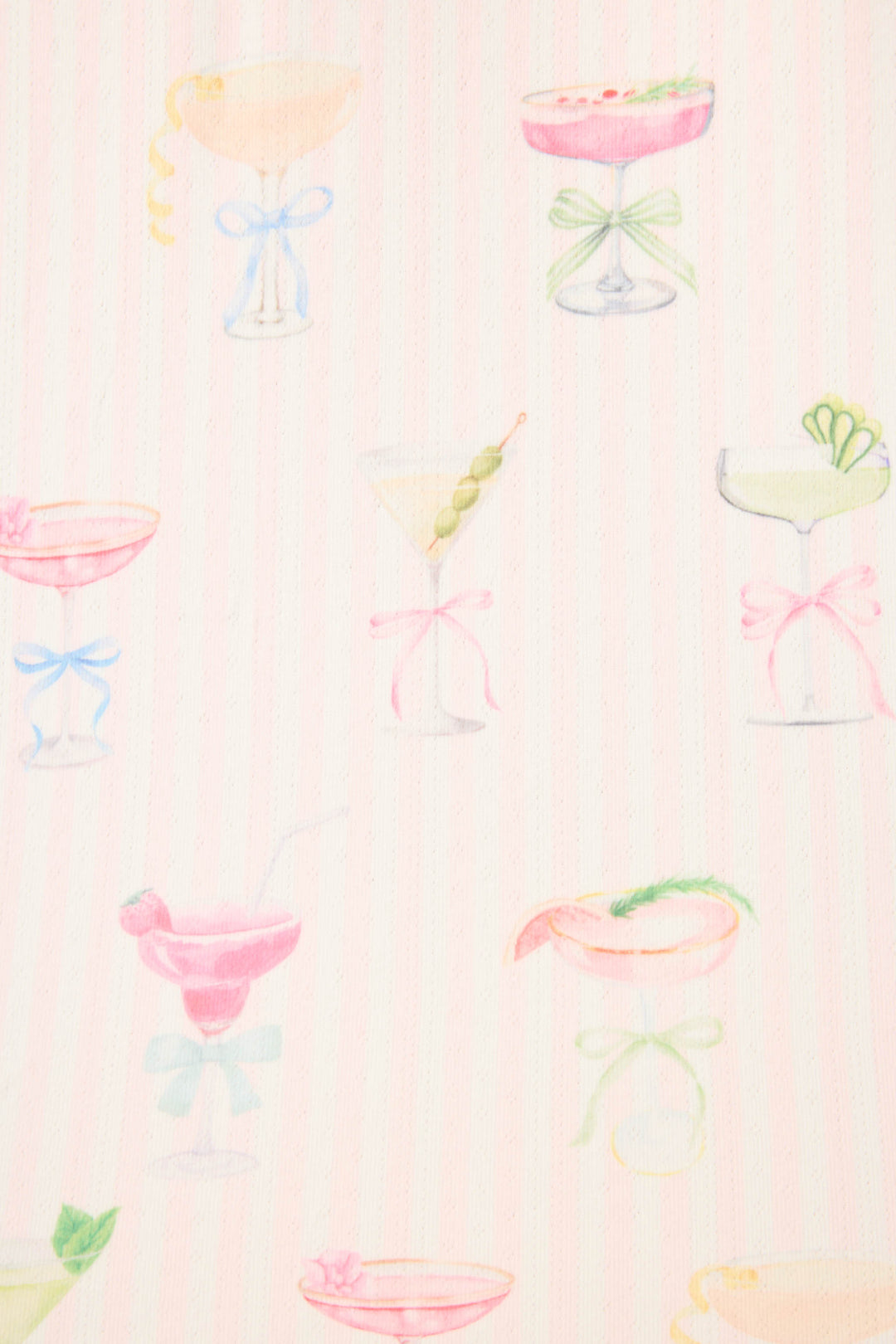 The P.J. Salvage Pretty Punch Cocktail Print Long Sleeve Top showcases pastel cocktail glasses with garnishes and bows on a soft pink background.