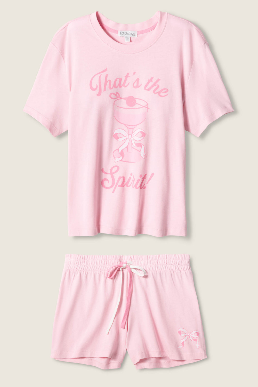 The Pretty Punch Thats The Spirit Loungewear Short Set by P.J. Salvage features a light pink short-sleeve tee with Thats the Spirit! and a smiling ghost graphic, plus matching shorts with a small bow print on one leg.