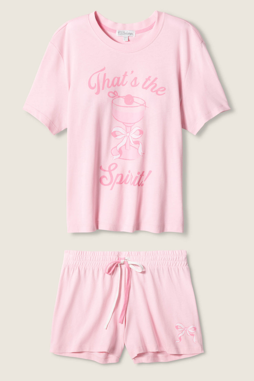 The Pretty Punch Thats The Spirit Loungewear Short Set by P.J. Salvage features a light pink short-sleeve tee with Thats the Spirit! and a smiling ghost graphic, plus matching shorts with a small bow print on one leg.
