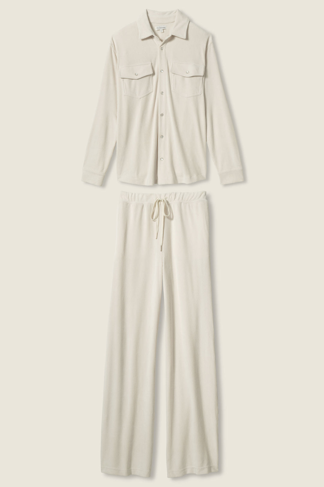 The SOLID PJ SET CRAVING CORDUROY by P.J. Salvage features a cream long-sleeve, button-up shirt with two chest pockets and drawstring pants, both crafted from soft, textured corduroy and shown against a light background.