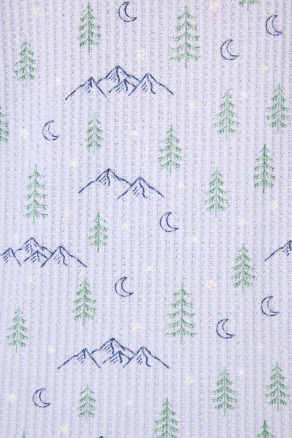 The P.J. Salvage Ski Jammie Classics Winter Tree Print PJ Set features a repeating pattern of blue mountains, green pine trees, crescent moons, and yellow stars on a white textured background.