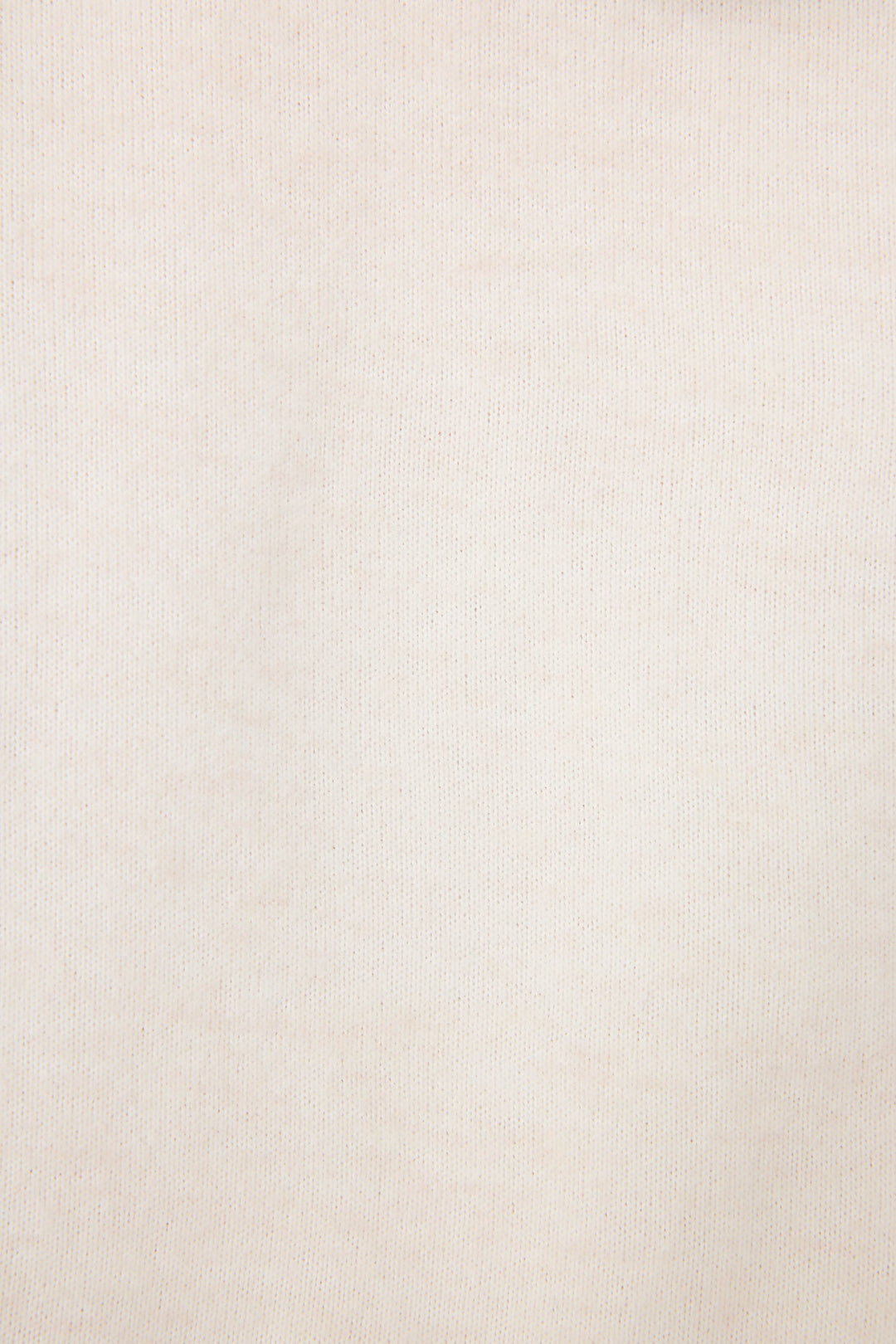 Close-up of The Outsider Fleece Graphic Hoodie by P.J. Salvage in beige, featuring a subtle texture and visible weave pattern. The fabric appears smooth and even with minimal color variation.