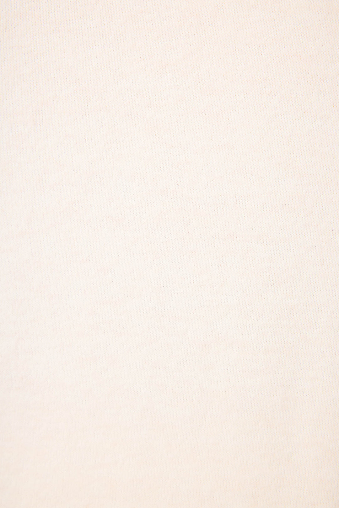 A close-up view of the light beige fabric of P.J. Salvage’s The Outsider Graphic Jogger Lounge Set, featuring a subtle woven texture with no visible patterns or markings.