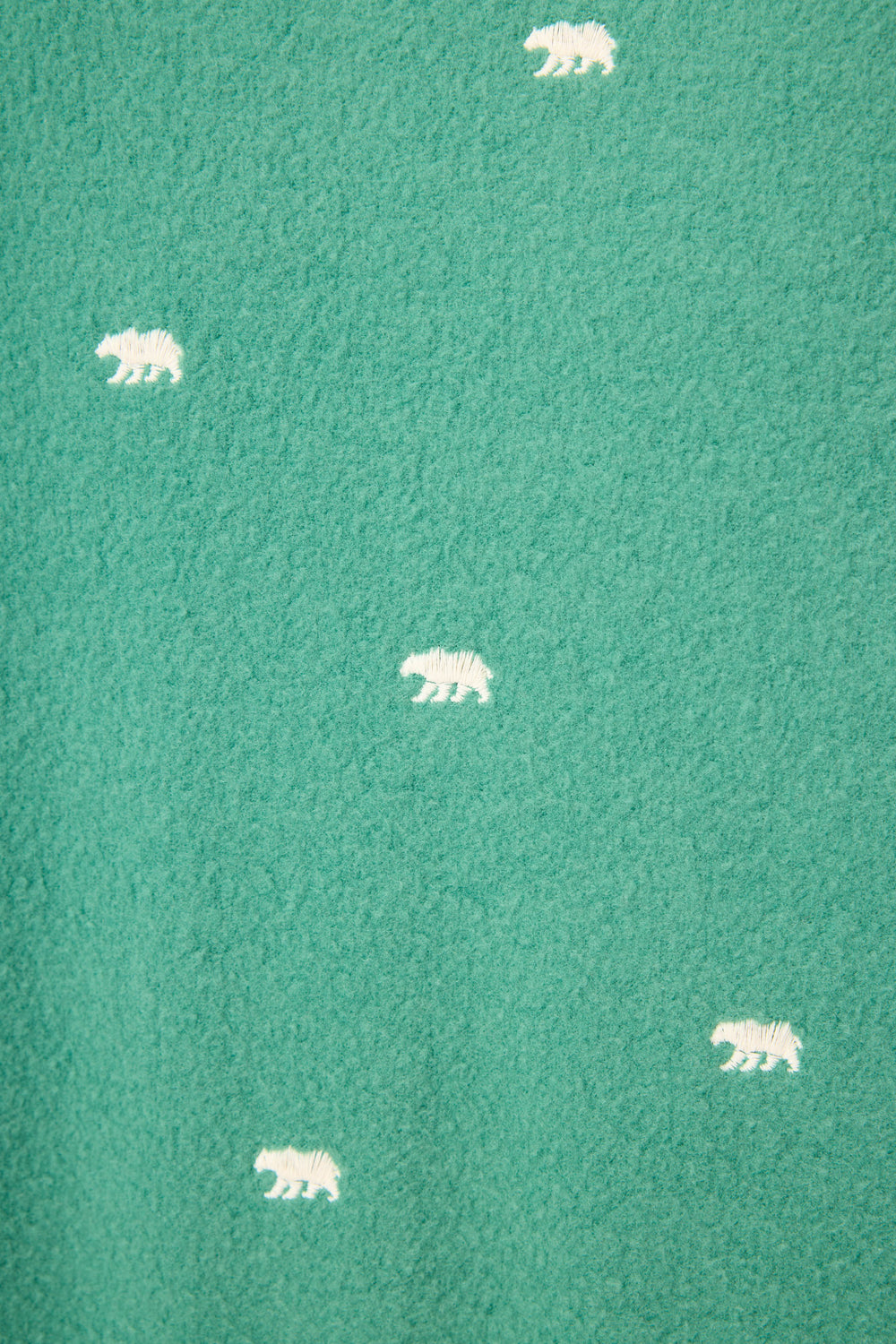 The Outsider Embroidered Bear Fleece Lounge Set by P.J. Salvage features green textured fabric adorned with evenly spaced, small white bear silhouettes.