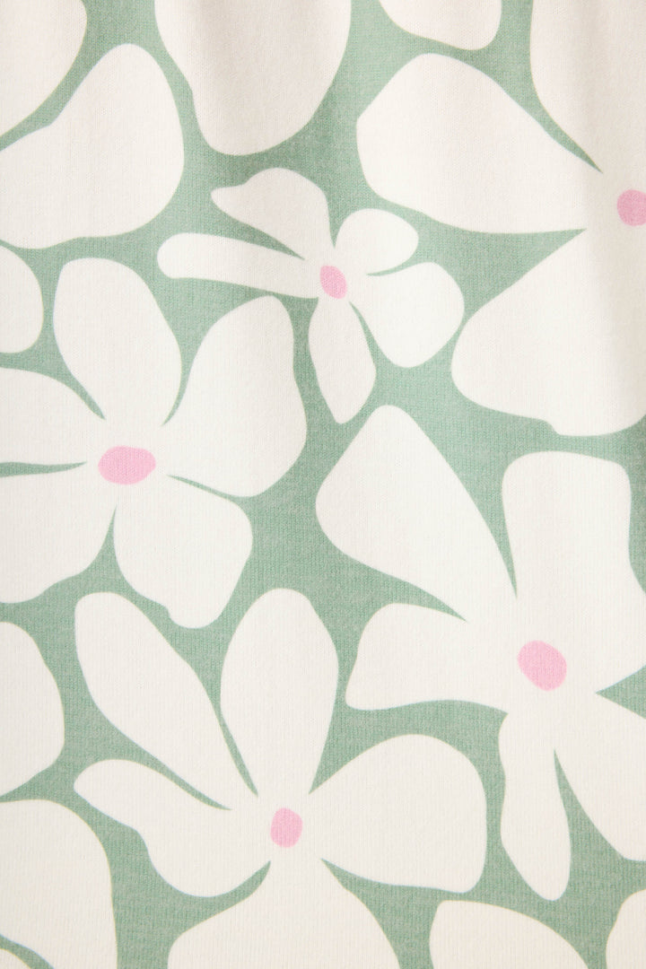 The Wish You Were Here Floral Print Banded Pants by P.J. Salvage feature a simple, stylized design with white abstract flowers and pink centers on a light green background.