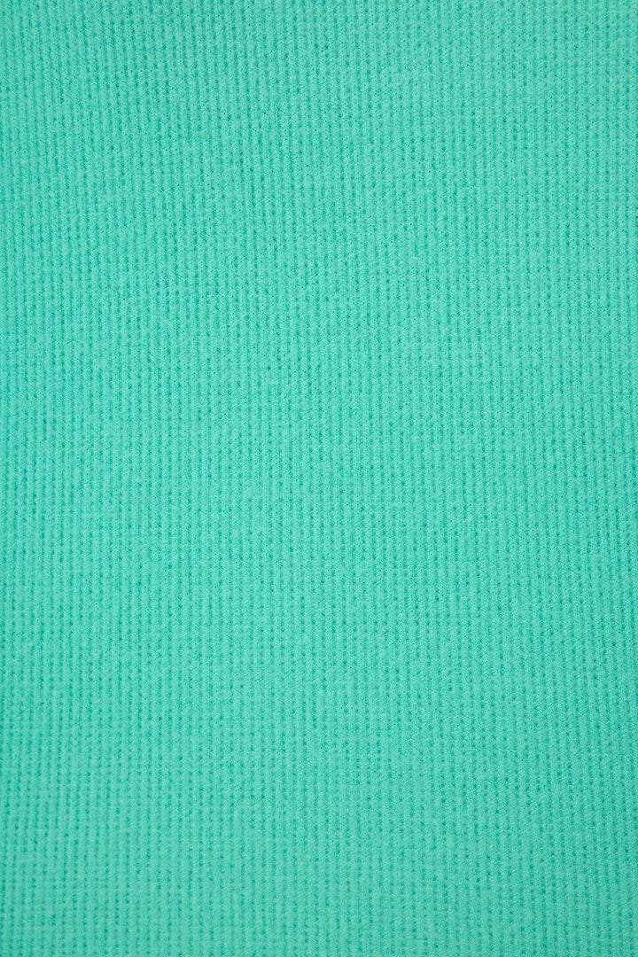 Close-up of the P.J. Salvage Boyfriend Boxer Solid Green Short Set, showing its teal blue ribbed fabric with evenly spaced vertical textured lines. The material looks soft and stretchy for added comfort.
