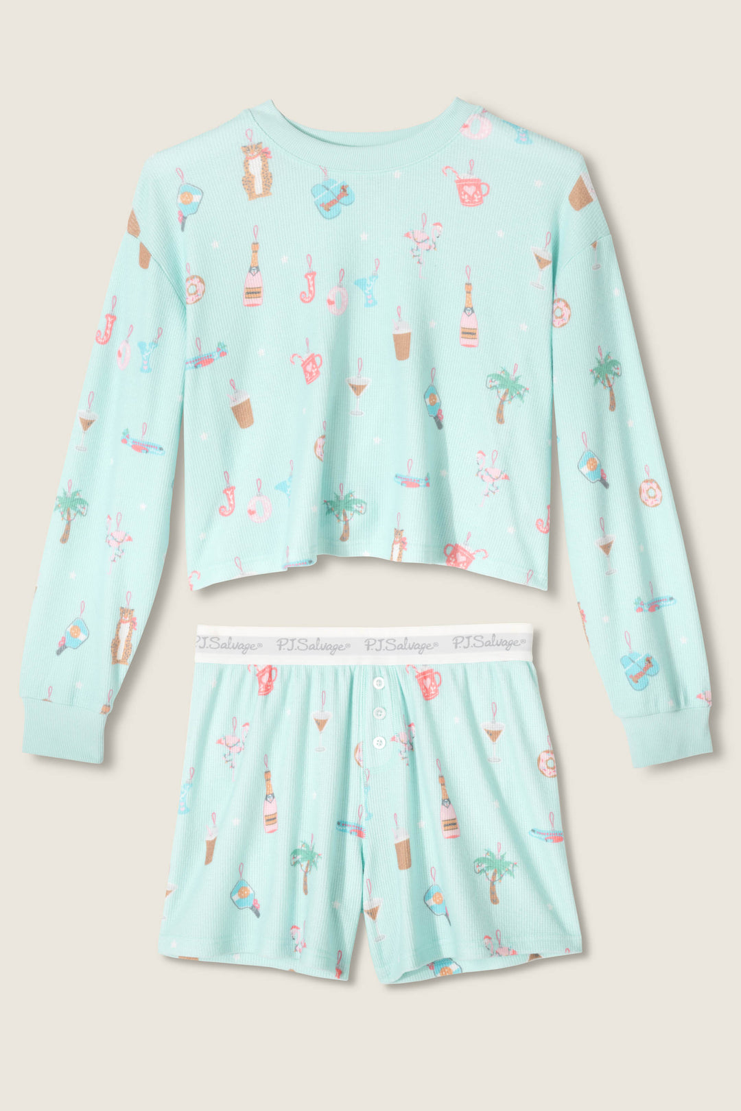 The P.J. Salvage Boyfriend Boxer Ornament Print Shorts Set includes a long-sleeve, light blue crop top and shorts with a tropical beach-themed print featuring palm trees, drinks, sunglasses, and seashells.