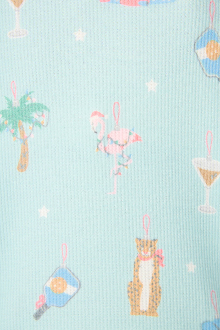 The Boyfriend Boxer Ornament Print Shorts Set by P.J. Salvage features light blue fabric adorned with palm trees, flamingos, cocktails, a tennis racket, a seated leopard, and small white stars.