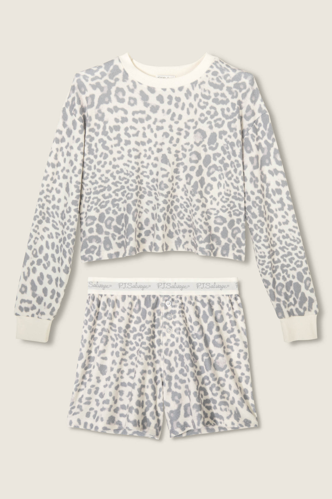 The Boyfriend Boxer Leopard Print Shorts Set by P.J. Salvage features a long-sleeve top and shorts in a white and gray leopard print with ribbed cuffs and waistband, displayed flat on a light beige background.