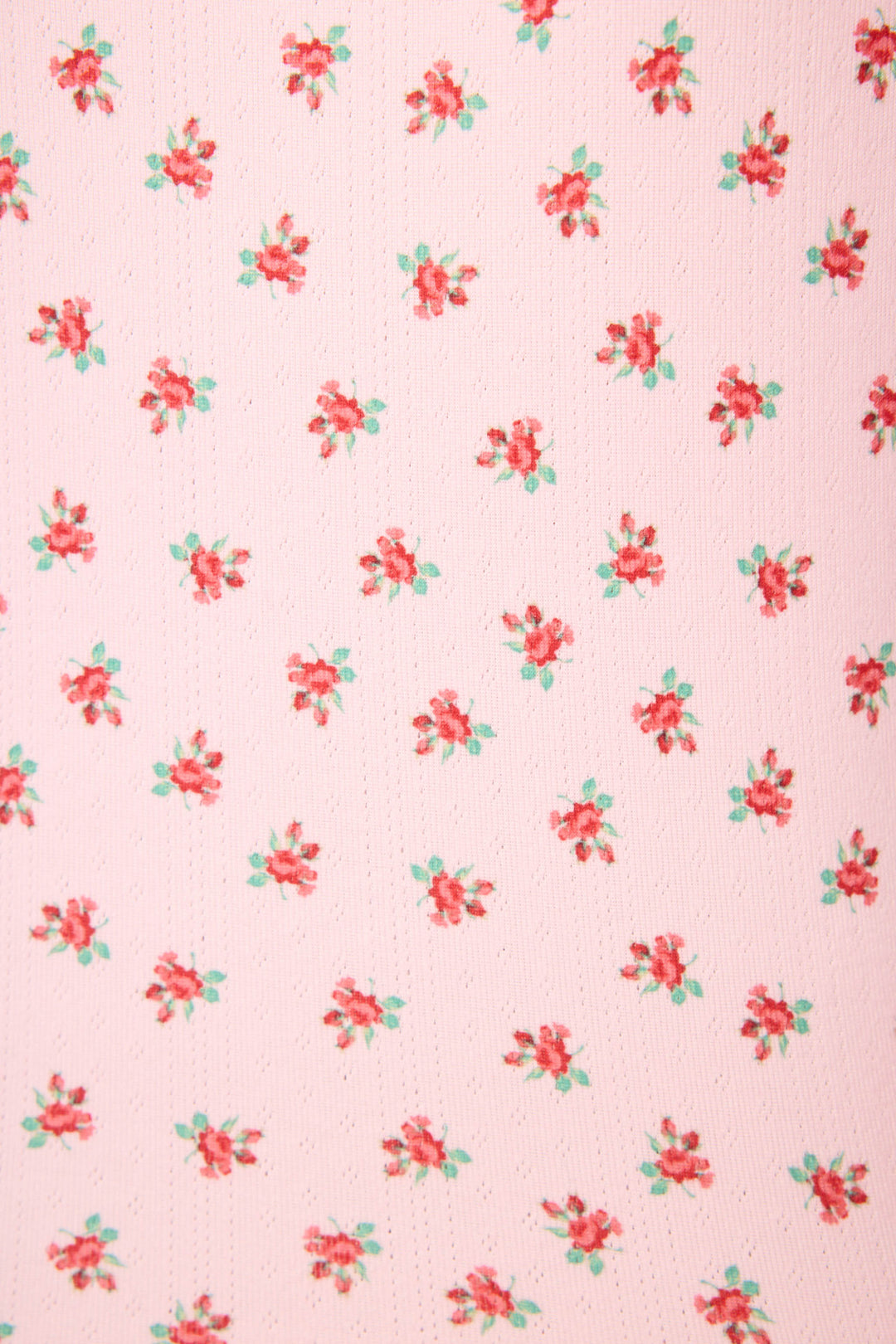 The Crazy For The Holidays Ditsy Floral Print Pants Set by P.J. Salvage features a pink pointelle fabric with evenly spaced red and green ditsy floral clusters, giving these girls' holiday pajamas a festive and decorative look.