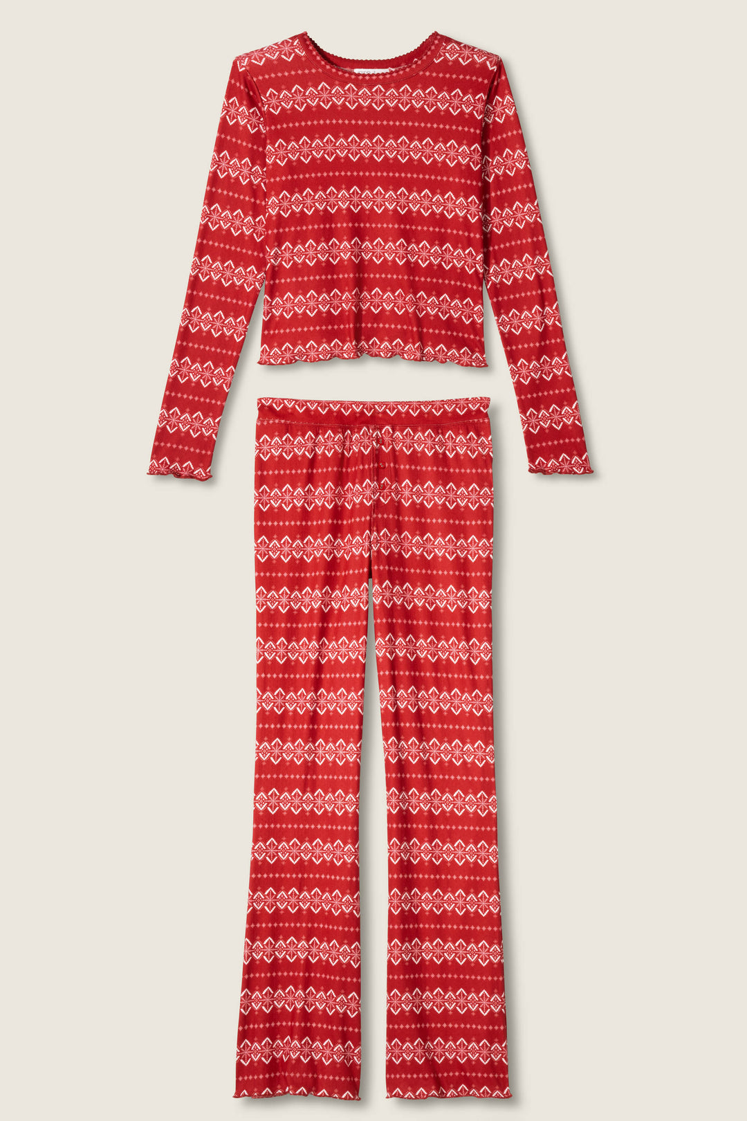 The P.J. Salvage Crazy For The Holidays Fairisle Print Pants Set is a cozy two-piece red pointelle pajama set with long sleeves, flared pants, and white heart and geometric Fair Isle motifs—perfect for holiday lounging.