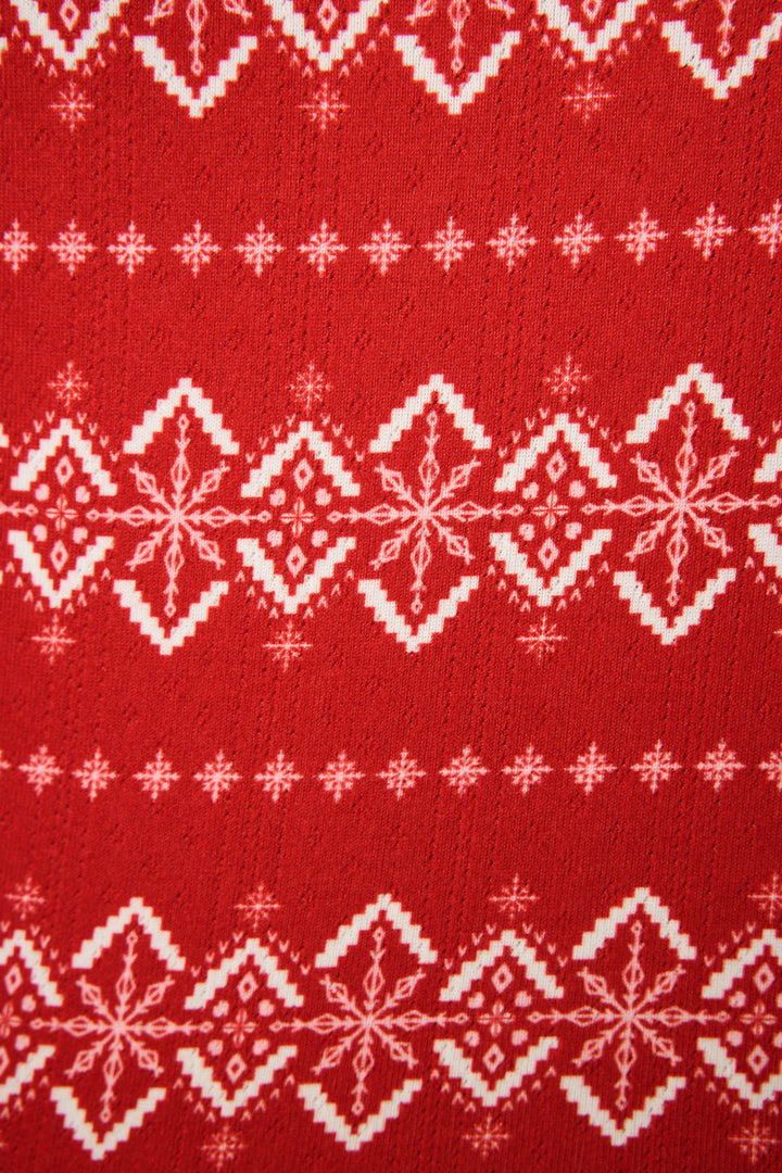 The Crazy For The Holidays Fairisle Print Pants Set by P.J. Salvage features red fabric with a white Fair Isle snowflake pattern in horizontal rows, evoking classic winter style for cozy holiday pajamas.