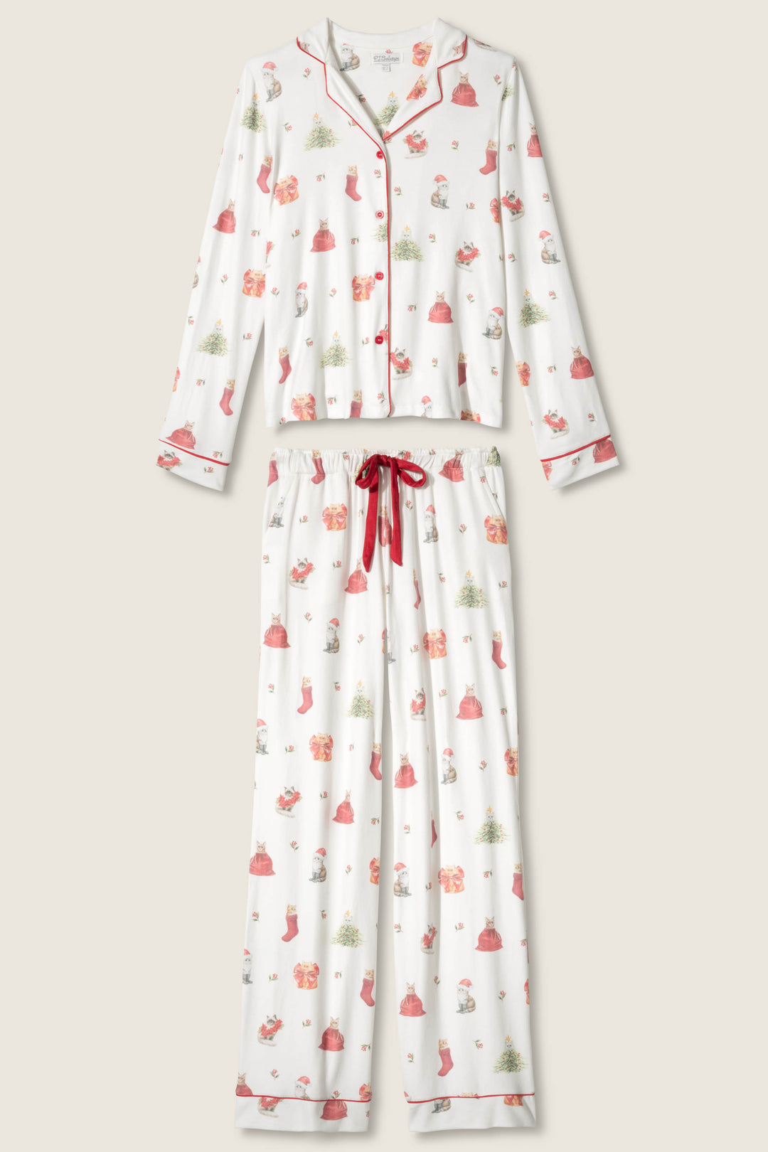 The P.J. Salvage Feline Festive Cat Print PJ Set includes a long-sleeve button-up top and drawstring pants with red piping on white fabric, a holiday cat print, and a red ribbon waistband.