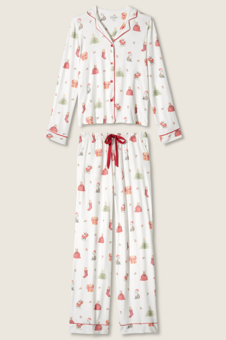The P.J. Salvage Feline Festive Cat Print PJ Set includes a long-sleeve button-up top and drawstring pants with red piping on white fabric, a holiday cat print, and a red ribbon waistband.