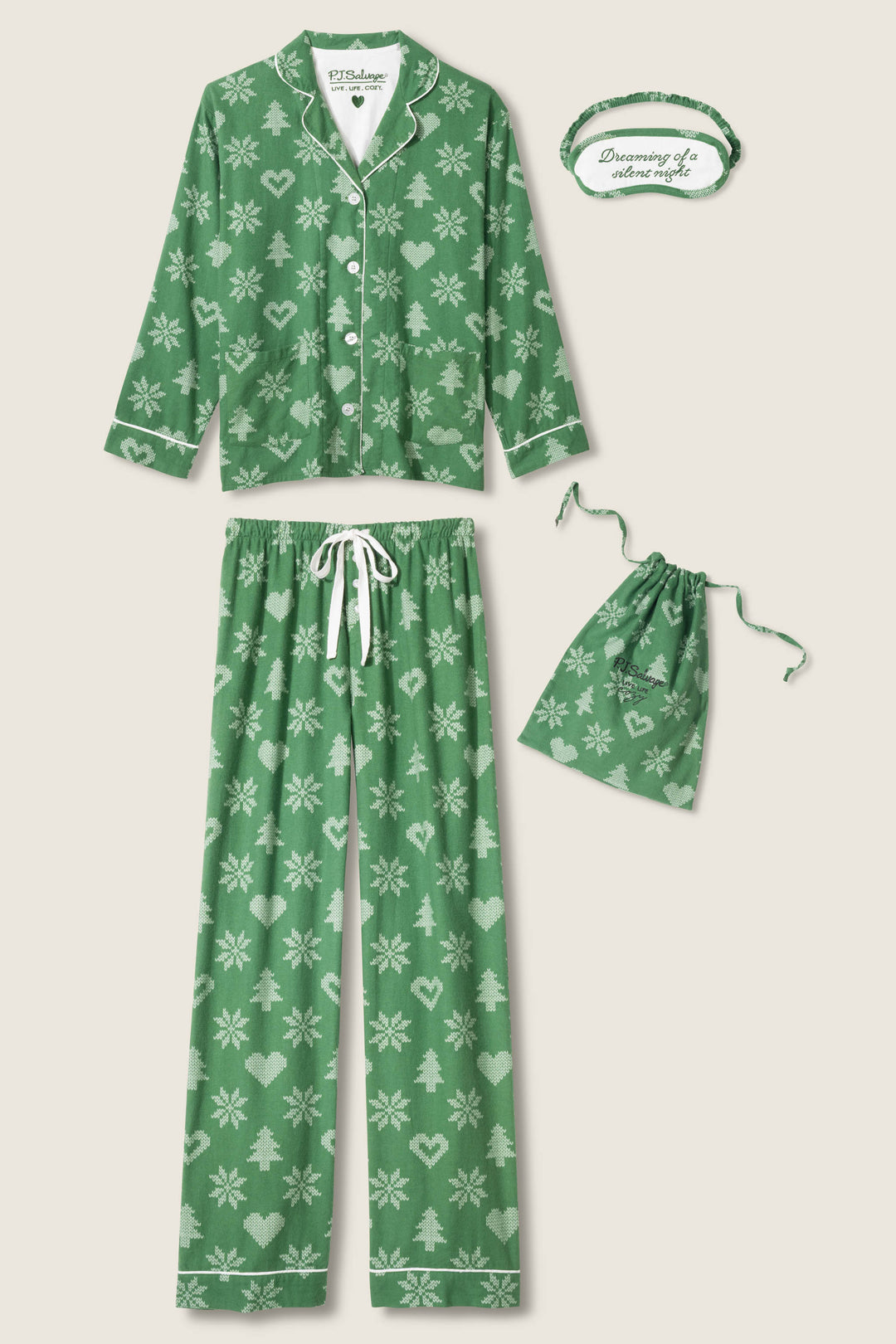 The P.J. Salvage 4-Piece Tree & Heart Print Flannel PJ Set features a green long-sleeve top, drawstring pants, matching pouch, and an eye mask with "Dreaming of adventure" – all with festive white snowflake, heart, and tree prints.