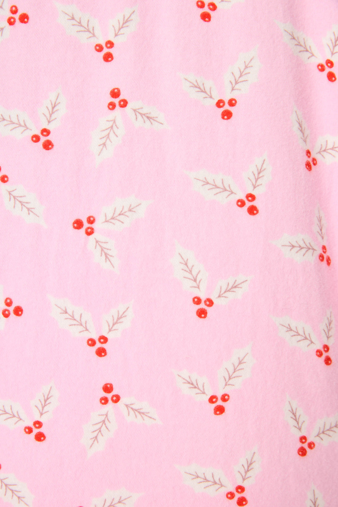 The P.J. Salvage 4-Piece Mistletoe Print Flannel PJ Set features pink fabric with a repeating design of mistletoe, showing clusters of three red berries and three light green leaves.