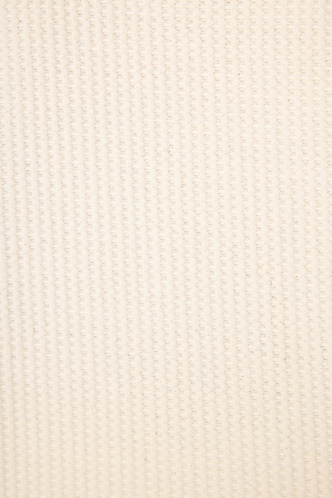 Close-up of the SOLID PJ SET FIRESIDE SPARKLE SETS by P.J. Salvage, featuring a soft beige fabric with a woven look and a regular, raised grid pattern running vertically and horizontally across the surface.