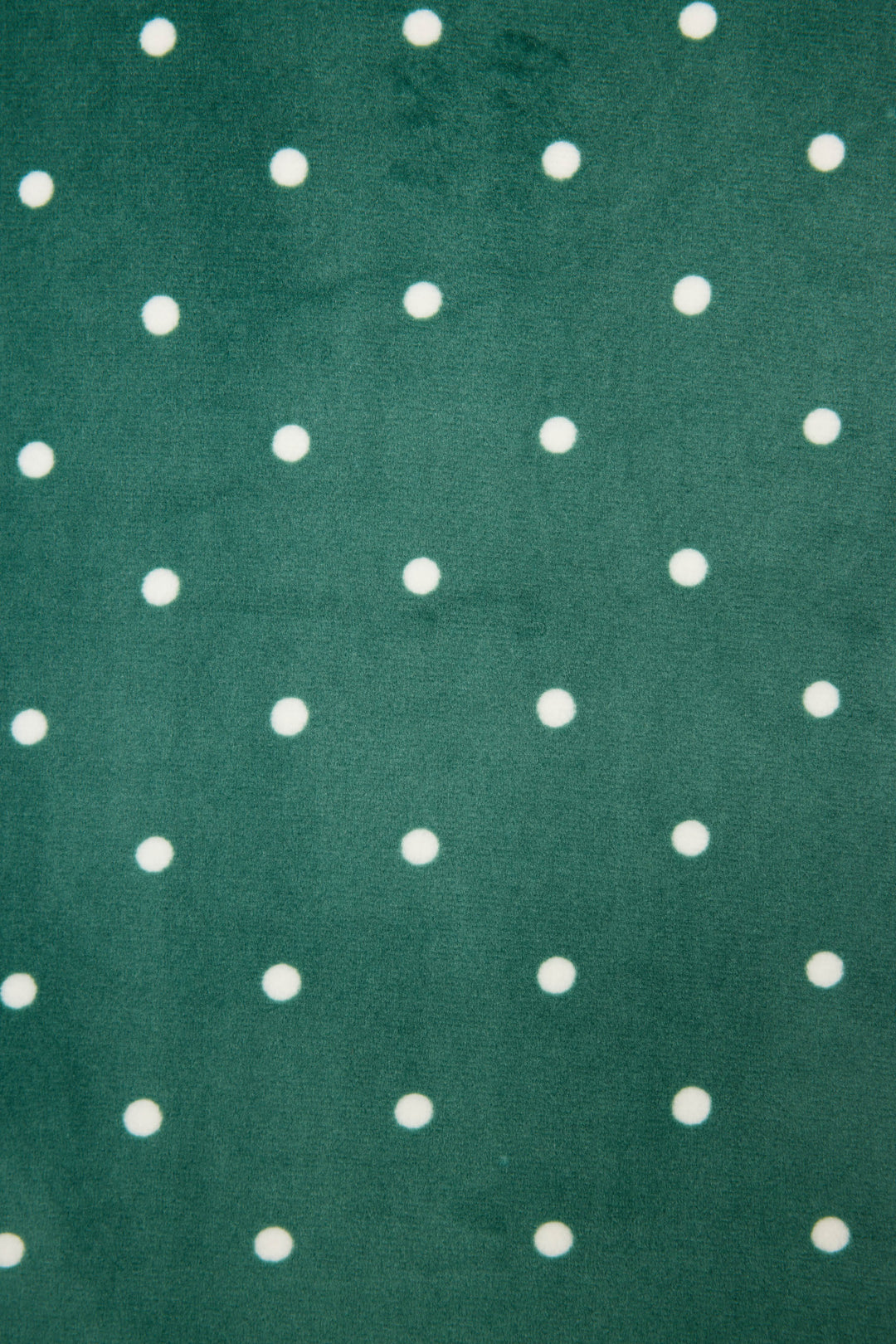 The Let's Get Toasty Dot Print Pants Set by P.J. Salvage features green fabric with evenly spaced white polka dots in a grid pattern.