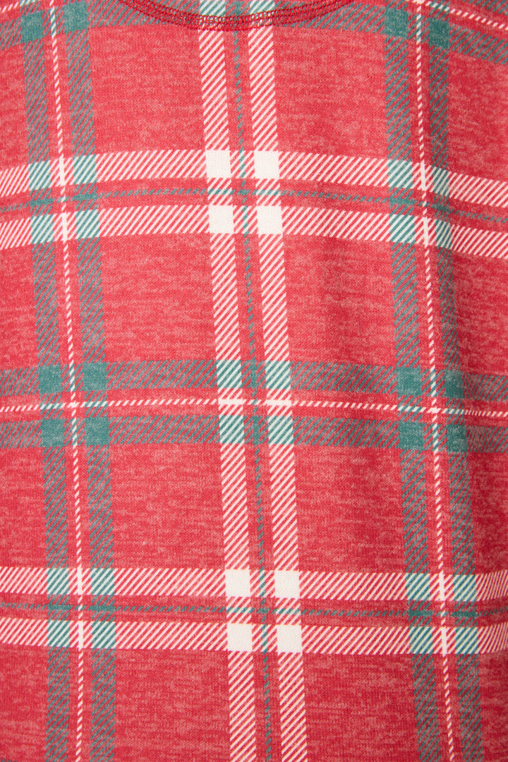 A close-up of the Let's Get Toasty Red Plaid Pants Set by P.J. Salvage, showcasing its red fabric with intersecting white and green plaid lines.
