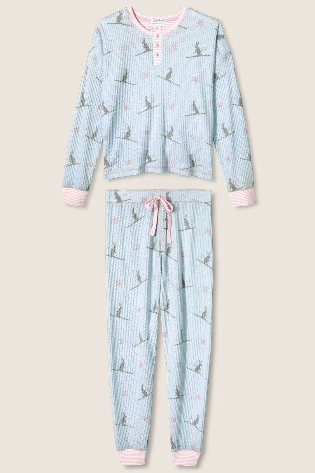 The P.J. Salvage Ski Jammie Classics Ski Bunny PJ Set is a two-piece pajama with light blue and white stripes, grey dinosaur silhouettes, pink dots, and light pink trim on the cuffs, neckline, and waistband.