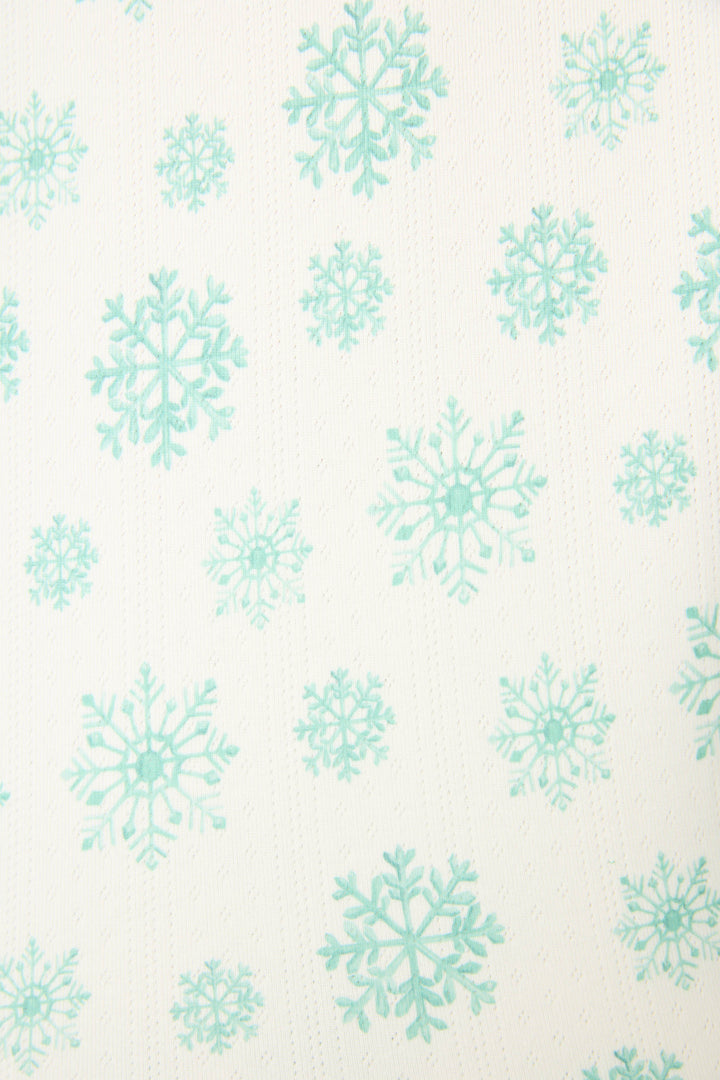 The SNOWFLAKE SHORT SNOWFLAKE WISHES by P.J. Salvage features a white background with an evenly spaced pattern of teal snowflakes in various sizes.