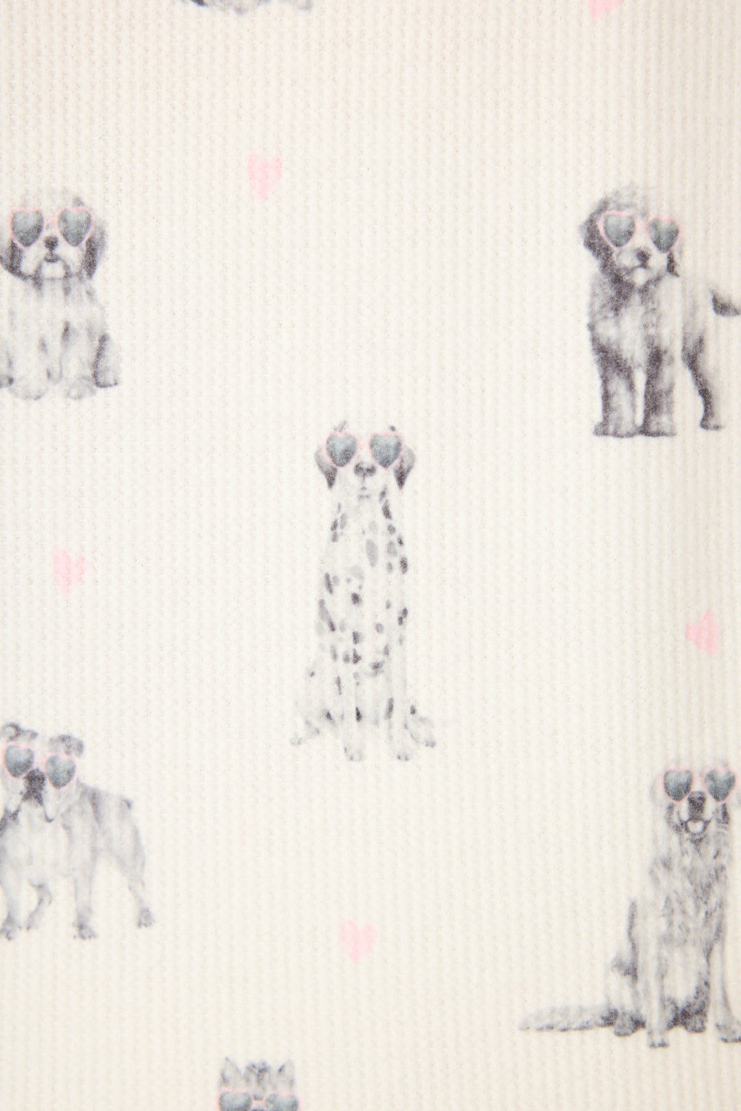 The My Dog Is My Valentine PJ Set by P.J. Salvage features cream-colored fabric with a repeating pattern of illustrated puppies wearing heart-shaped sunglasses and scattered small pink hearts.
