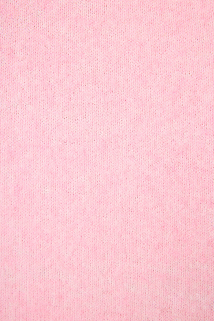 Close-up of P.J. Salvage's Feeling Loved "Lover" Snuggle Sweater, featuring soft, light pink fabric with a subtle, even texture and fine vertical ribbing.