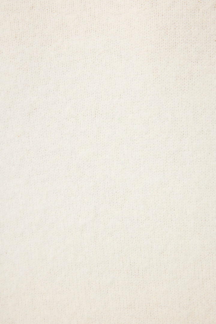 Close-up of the Happy Hour "Lets Drink About it" Snuggle Sweater by P.J. Salvage, showing off-white, textured fabric with a subtle woven pattern and consistent color, free from visible designs or markings.