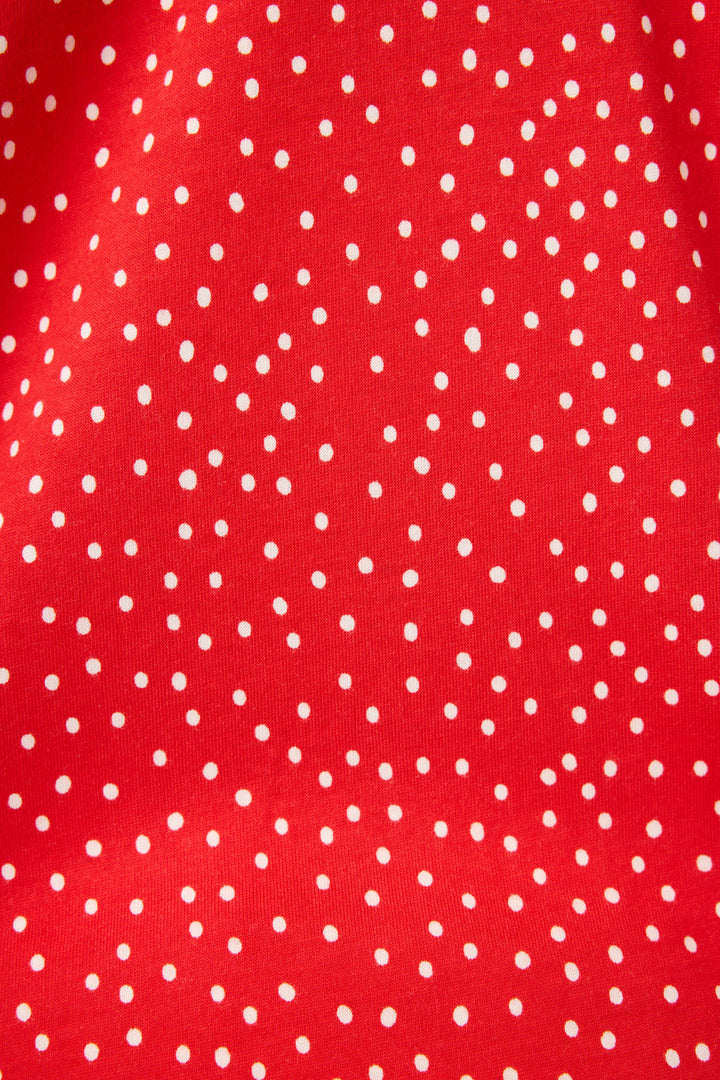 The Mix and Match Strawberry Dreams Sleep Set by P.J. Salvage features red fabric with evenly spaced small white polka dots and a subtly visible texture across the entire surface.