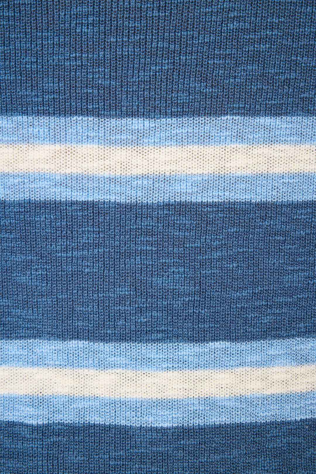 Close-up of the More Amour Striped Open Leg Pants by P.J. Salvage, showcasing knitted fabric with horizontal blue and white stripes in thick and thin bands, and a clearly visible textured yarn.
