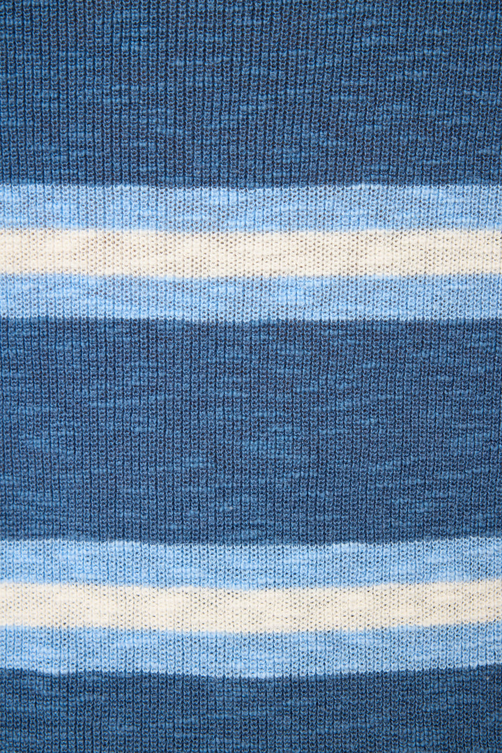 Close-up of the More Amour Striped Open Leg Pants by P.J. Salvage, showcasing knitted fabric with horizontal blue and white stripes in thick and thin bands, and a clearly visible textured yarn.