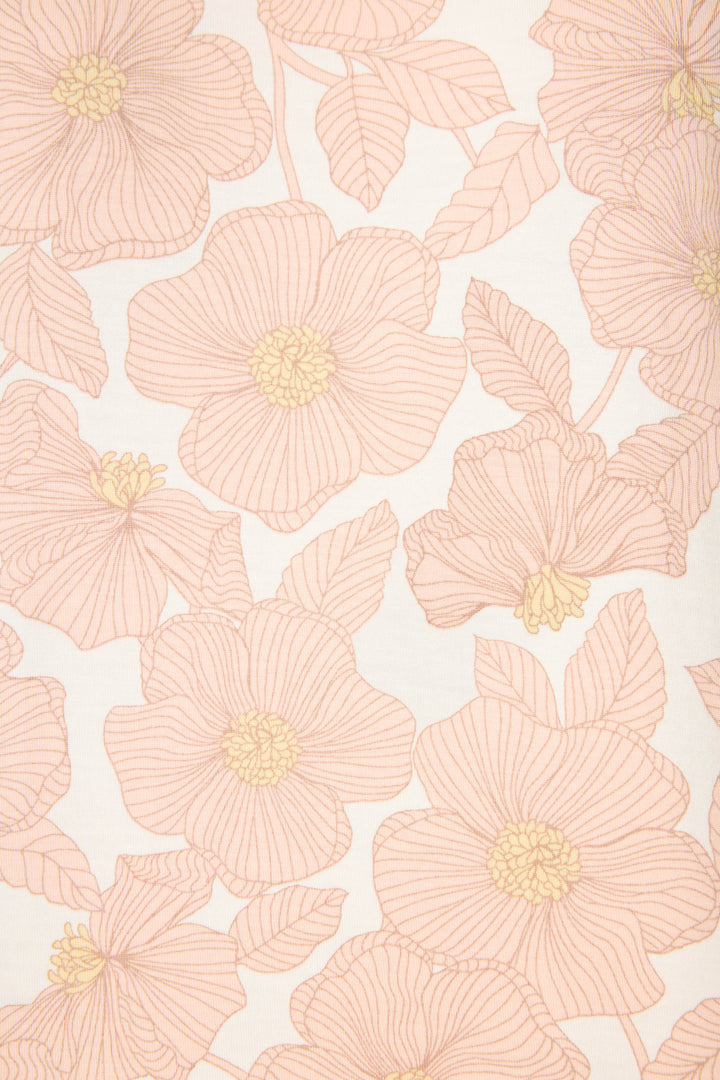 The Poppy Dreams Floral Shorts by P.J. Salvage feature a cream-colored fabric adorned with large light pink flowers, yellow centers, and detailed linework, each bloom surrounded by leaves in a repeating pattern.