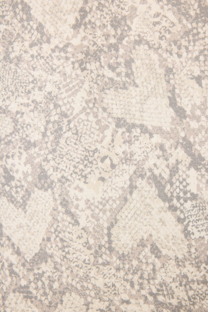 A close-up of the Snakeskin Heart Print Peachy PJ Set by P.J. Salvage, showcasing textured fabric in light beige and gray with a subtle snakeskin pattern and faint heart shapes.